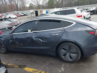 2019 Tesla Model 3 Mid Range with VIN 5YJ3E1EA3KF426971, listed as a IAAI auction lot 41564939 with Not Provided miles and . Bid and sale history available at carsss.com. Image 14.
