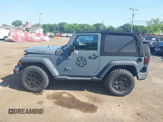 2015 Jeep Wrangler Freedom Edition with VIN 1C4AJWAG1FL714002, listed as a IAAI auction lot 42579024 with 98,732 mi miles and . Bid and sale history available at DreamBid. Image 14.