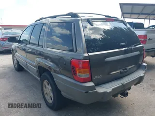 1999 Jeep Grand Cherokee Laredo with VIN 1J4GW58S2XC524365, listed as a IAAI auction lot 42432625 with 284,942 mi miles and . Bid and sale history available at DreamBid. Image 3.