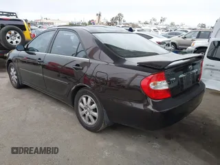2002 Toyota Camry XLE z VIN JTDBF32K520006497, wystawiony jako IAAI lot #42021538 z przebiegiem 162 583 mil mil oraz . Historia ofert i sprzedaży dostępna na DreamBid. Obrazek 3.