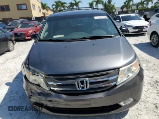 2011 Honda Odyssey Touring with VIN 5FNRL5H97BB501213, listed as a Copart auction lot 57314115 with 283,538 mi miles and Salvage title. Bid and sale history available at DreamBid. Image 5.