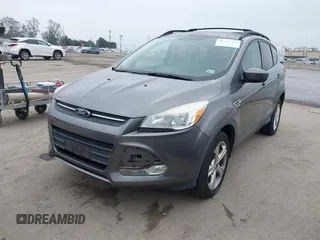 2014 Ford Escape SE with VIN 1FMCU9GX7EUC04296, listed as a IAAI auction lot 42159486 with 108,598 mi miles and . Bid and sale history available at DreamBid. Image 2.