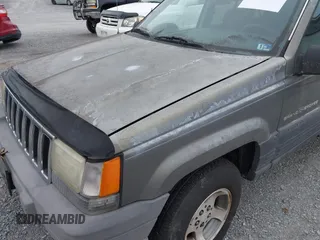 1996 Jeep Grand Cherokee with VIN 1J4EZ58S1TC112995, listed as a IAAI auction lot 41706966 with 356,727 mi miles and . Bid and sale history available at DreamBid. Image 14.