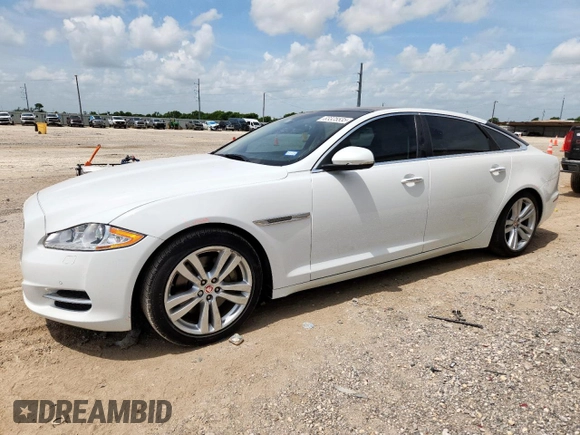 2015 Jaguar XJ Portfolio with VIN SAJWA2GZ7F8V82990, listed as a Copart auction lot 63325535 with 113,892 mi miles and Salvage title. Bid and sale history available at DreamBid. Image 1.