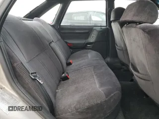 1991 Ford Taurus with VIN 1FACP52U9MG101093, listed as a Copart auction lot 45948105 with 594,696 mi miles and Salvage title. Bid and sale history available at DreamBid. Image 10.