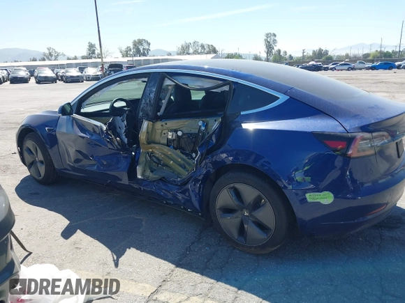 2020 Tesla Model 3 Standard Range Plus with VIN 5YJ3E1EA1LF590396, listed as a IAAI auction lot 41868089 with 51,278 mi miles. Bid and sale history available at carsss.com. Image 14.