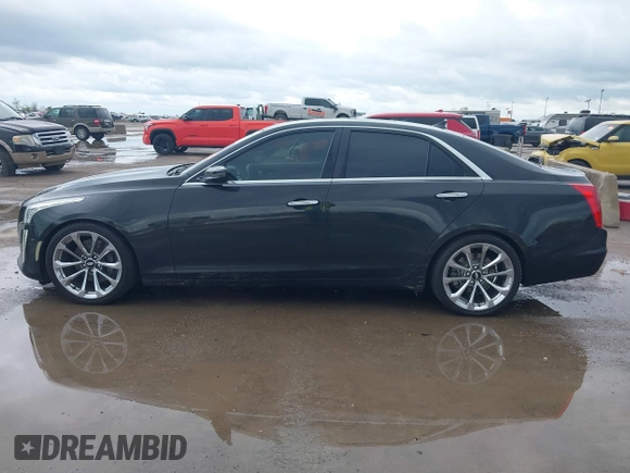 2014 Cadillac CTS Vsport Premium RWD z VIN 1G6AV5S89E0148907, wystawiony jako IAAI lot #41880678 z przebiegiem 148 052 mil mil oraz . Historia ofert i sprzedaży dostępna na DreamBid. Obrazek 14.