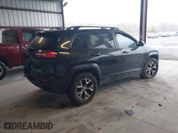 2014 Jeep Cherokee Trailhawk with VIN 1C4PJMBS3EW150366, listed as a IAAI auction lot 41971035 with 90,994 mi miles. Bid and sale history available at carsss.com. Image 4.