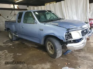 1997 Ford F-150 with VIN 1FTDX076XVKC72073, listed as a Copart auction lot 62774955 with 204,105 mi miles and Salvage title. Bid and sale history available at DreamBid. Image 4.