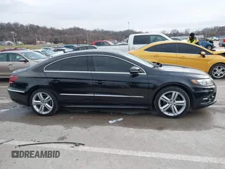 2014 Volkswagen CC R-Line with VIN WVWBN7ANXEE521055, listed as a IAAI auction lot 41197539 with 94,902 mi miles. Bid and sale history available at carsss.com. Image 13.