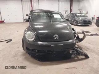 2012 Volkswagen Beetle 2.5L PZEV with VIN 3VWJP7AT3CM623533, listed as a IAAI auction lot 40972471 with 95,906 mi miles. Bid and sale history available at carsss.com. Image 12.