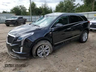 2023 Cadillac XT5 FWD Luxury z VIN 1GYKNAR40PZ106096, wystawiony jako Copart lot #80909074 z przebiegiem 19 677 mil mil oraz Nie do naprawy • Non repairable. Historia ofert i sprzedaży dostępna na DreamBid. Obrazek 1.