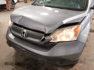 2009 Honda CR-V LX with VIN JHLRE48359C018488, listed as a IAAI auction lot 41824887 with 203,235 mi miles. Bid and sale history available at carsss.com. Image 6.