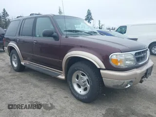 1999 Ford Explorer XLT z VIN 1FMDU34E0XZA39945, wystawiony jako IAAI lot #41877978 z przebiegiem 246 050 mil mil oraz . Historia ofert i sprzedaży dostępna na DreamBid. Obrazek 1.