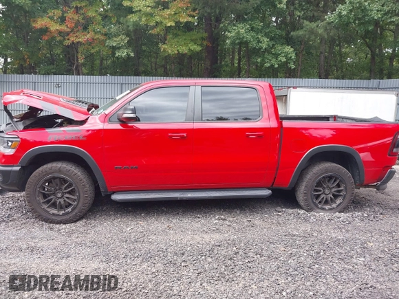 2021 Ram 1500 Rebel with VIN 1C6SRFLT2MN591844, listed as a IAAI auction lot 40410248 with 84,759 mi miles and . Bid and sale history available at DreamBid. Image 14.