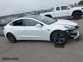 2019 Tesla Model 3 Long Range with VIN 5YJ3E1EB2KF361541, listed as a IAAI auction lot 41859373 with 54,664 mi miles. Bid and sale history available at carsss.com. Image 14.