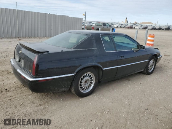 1999 Cadillac Eldorado Touring z VIN 1G6ET1298XU602343, wystawiony jako Copart lot #44327195 z przebiegiem 52 327 mil mil oraz Szkody całkowita. Historia ofert i sprzedaży dostępna na DreamBid. Obrazek 3.