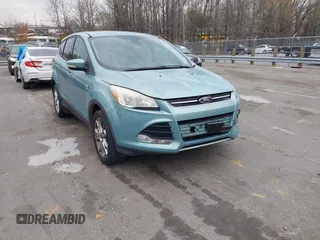 2013 Ford Escape SEL z VIN 1FMCU9HX1DUC32138, wystawiony jako IAAI lot #41864067 z przebiegiem 183 725 mil mil oraz . Historia ofert i sprzedaży dostępna na DreamBid. Obrazek 1.