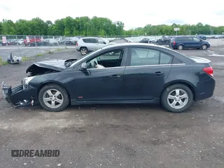 2014 Chevrolet Cruze 1LT z VIN 1G1PC5SB6E7138943, wystawiony jako IAAI lot #42368233 z przebiegiem 119 760 mil mil oraz . Historia ofert i sprzedaży dostępna na DreamBid. Obrazek 14.