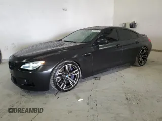 2016 BMW M6 z VIN WBS6E9C53GGF92658, wystawiony jako Copart lot #79003953 z przebiegiem 49 231 mil mil oraz . Historia ofert i sprzedaży dostępna na DreamBid. Obrazek 1.