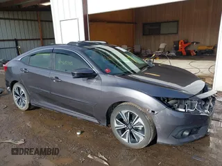 2018 Honda Civic EX-L z VIN JHMFC1F85JX014701, wystawiony jako IAAI lot #41467342 z przebiegiem 50 292 mil mil oraz . Historia ofert i sprzedaży dostępna na DreamBid. Obrazek 14.