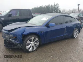 2022 Tesla Model 3 Long Range with VIN 5YJ3E1EB1NF142574, listed as a IAAI auction lot 41213900 with 127,404 mi miles and . Bid and sale history available at DreamBid. Image 6.