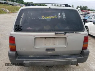 1996 Jeep Grand Cherokee Laredo with VIN 1J4GZ58S2TC401845, listed as a Copart auction lot 61013044 with 0 mi miles and Salvage Title. Bid and sale history available at carsss.com. Image 6.