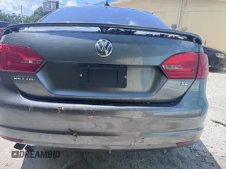2014 Volkswagen Jetta SE z VIN 3VWD17AJ7EM249444, wystawiony jako IAAI lot #42607896 z przebiegiem 92 800 mil mil oraz . Historia ofert i sprzedaży dostępna na DreamBid. Obrazek 6.