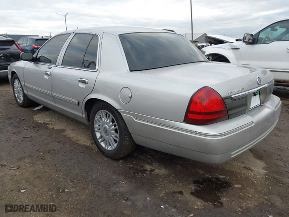 2010 Mercury Grand Marquis LS with VIN 2MEBM7FV1AX612153, listed as a IAAI auction lot 40979537 with 120,359 mi miles. Bid and sale history available at carsss.com. Image 3.