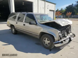 1999 GMC Suburban with VIN 3GKEC16R7XG542862, listed as a Copart auction lot 77568734 with 251,717 mi miles and Salvage Title. Bid and sale history available at carsss.com. Image 4.