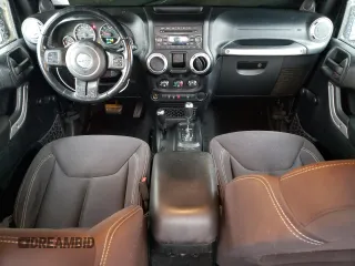 2013 Jeep Wrangler Rubicon with VIN 1C4BJWCG1DL584611, listed as a Copart auction lot 71536944 with 142,975 mi miles and Salvage title. Bid and sale history available at DreamBid. Image 8.