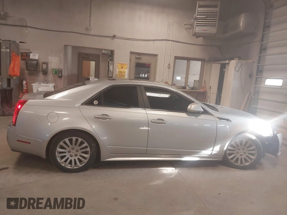2012 Cadillac CTS Premium z VIN 1G6DS5E33C0139591, wystawiony jako IAAI lot #41985026 z przebiegiem 151 810 mil mil oraz . Historia ofert i sprzedaży dostępna na DreamBid. Obrazek 13.