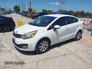 2013 Kia Rio SX with VIN KNADN4A33D6174454, listed as a IAAI auction lot 42032612 with 157,199 mi miles. Bid and sale history available at carsss.com. Image 2.