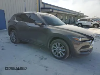 2021 Mazda CX-5 Grand Touring with VIN JM3KFBDM0M1464817, listed as a Copart auction lot 48821965 with 53,648 mi miles and Clean Title. Bid and sale history available at carsss.com. Image 4.