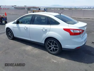 2012 Ford Focus SE with VIN 1FAHP3F24CL462319, listed as a IAAI auction lot 41981509 with 124,831 mi miles. Bid and sale history available at carsss.com. Image 3.