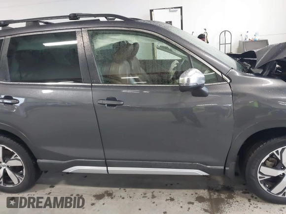 2021 Subaru Forester Touring with VIN JF2SKAXC8MH500831, listed as a IAAI auction lot 41564481 with 56,403 mi miles and . Bid and sale history available at DreamBid. Image 14.