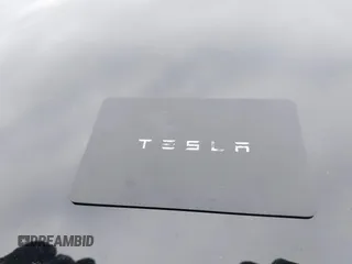 2023 Tesla Model 3 Long Range with VIN 5YJ3E1EBXPF708122, listed as a IAAI auction lot 41185314 with 27,765 mi miles and . Bid and sale history available at DreamBid. Image 11.