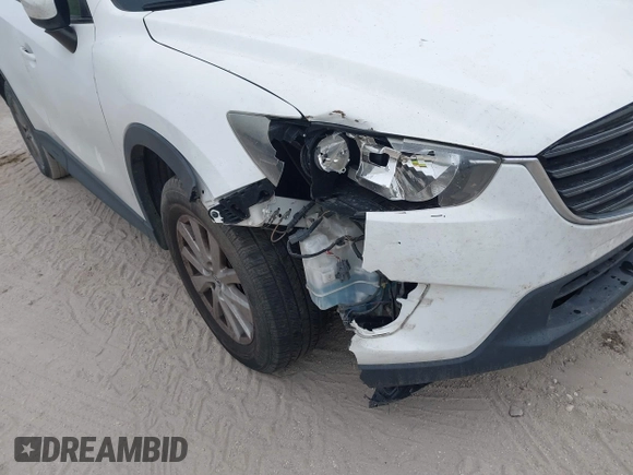 2016 Mazda CX-5 Sport with VIN JM3KE2BY1G0875484, listed as a IAAI auction lot 41838122 with 166,986 mi miles. Bid and sale history available at carsss.com. Image 6.