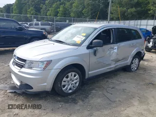 2014 Dodge Journey SE with VIN 3C4PDCAB7ET268221, listed as a IAAI auction lot 40262445 with 153,490 mi miles and . Bid and sale history available at carsss.com. Image 2.