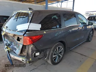 2021 Honda Odyssey Touring with VIN 5FNRL6H88MB040703, listed as a Copart auction lot 60340095 with 66,171 mi miles and Salvage title. Bid and sale history available at DreamBid. Image 3.