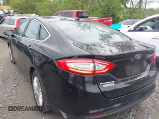 2016 Ford Fusion Energi SE Luxury with VIN 3FA6P0PU7GR293099, listed as a IAAI auction lot 42079873 with 194,755 mi miles. Bid and sale history available at carsss.com. Image 3.