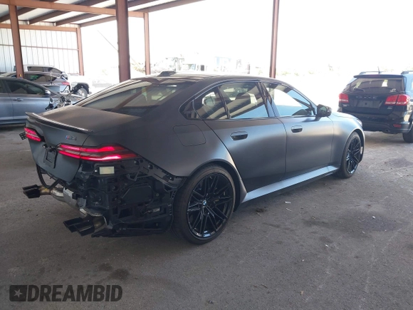 2025 BMW 5 Series with VIN WBS83FK04SCU11874, listed as a IAAI auction lot 42543784 with 4,517 mi miles and . Bid and sale history available at DreamBid. Image 4.