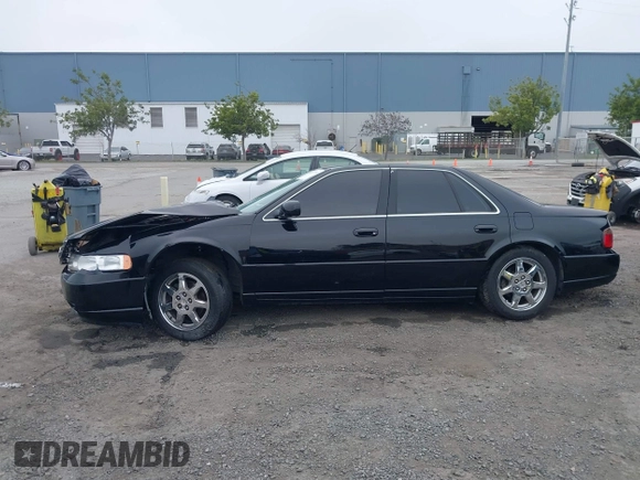 2002 Cadillac Seville Touring STS z VIN 1G6KY54982U239673, wystawiony jako IAAI lot #41657709 z przebiegiem 92 224 mil mil oraz . Historia ofert i sprzedaży dostępna na DreamBid. Obrazek 15.
