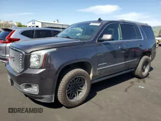 2015 GMC Yukon Denali with VIN 1GKS2CKJ8FR596848, listed as a Copart auction lot 52048105 with 129,935 mi miles and Salvage Title. Bid and sale history available at carsss.com. Image 1.