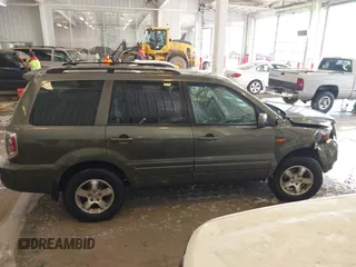 2006 Honda Pilot EX-L with VIN 5FNYF187X6B026463, listed as a IAAI auction lot 41612181 with 242,828 mi miles and . Bid and sale history available at DreamBid. Image 13.