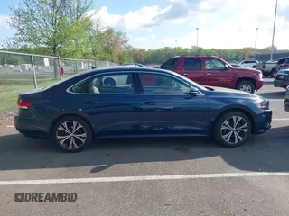 2021 Volkswagen Passat SE with VIN 1VWSA7A36MC010749, listed as a IAAI auction lot 42141065 with 43,571 mi miles and . Bid and sale history available at DreamBid. Image 13.