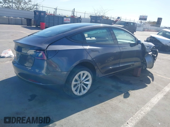 2022 Tesla Model 3 with VIN 5YJ3E1EA1NF142713, listed as a IAAI auction lot 42027630 with 112,557 mi miles. Bid and sale history available at carsss.com. Image 4.