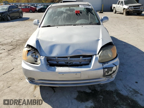 2005 Hyundai Accent GLS with VIN KMHCG45C75U638812, listed as a Copart auction lot 77968234 with 130,815 mi miles and Salvage Title. Bid and sale history available at carsss.com. Image 5.