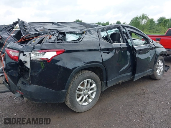 2021 Chevrolet Traverse LS with VIN 1GNERFKW8MJ174079, listed as a IAAI auction lot 42618437 with 66,541 mi miles and . Bid and sale history available at DreamBid. Image 4.