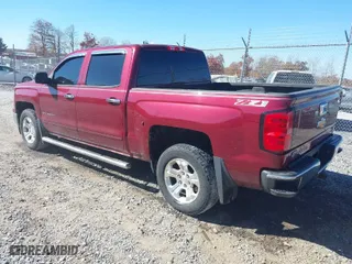 2015 Chevrolet Silverado 1500 LT with VIN 3GCUKREC6FG185646, listed as a IAAI auction lot 40702001 with 187,304 mi miles. Bid and sale history available at carsss.com. Image 3.